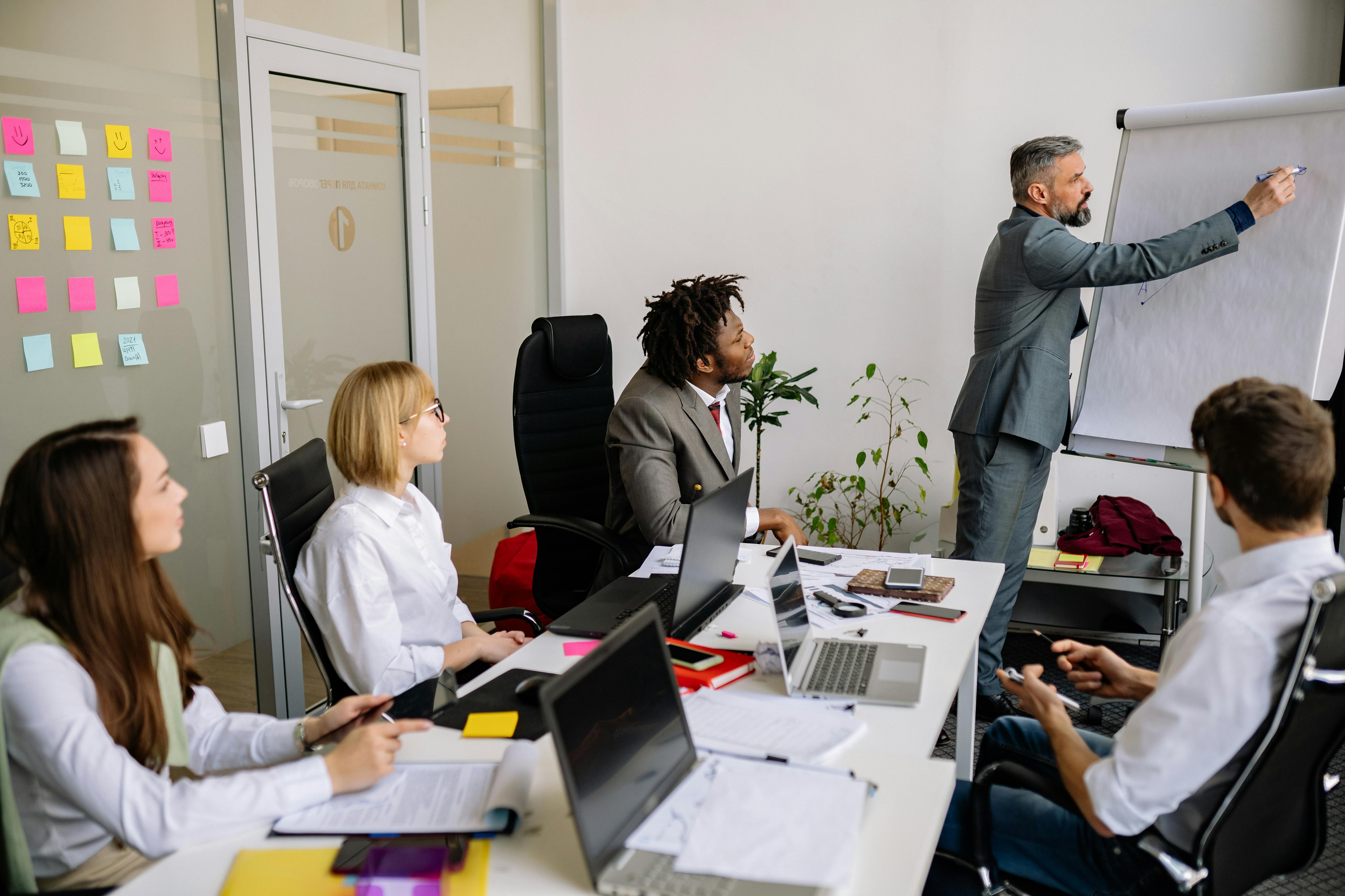 people having meeting in the room