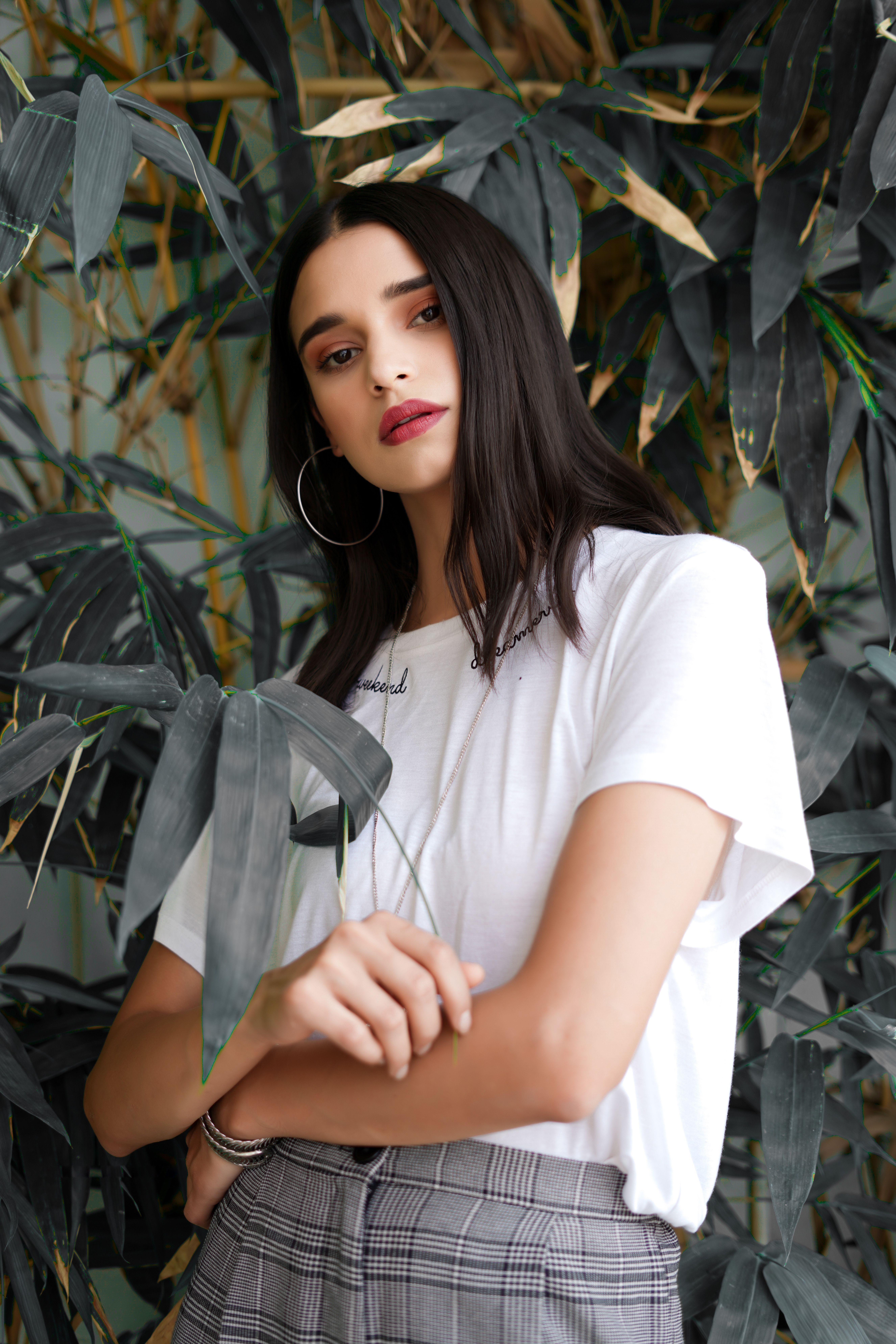 A Woman in White Shirt Seriously Looking at the Camera · Free Stock Photo