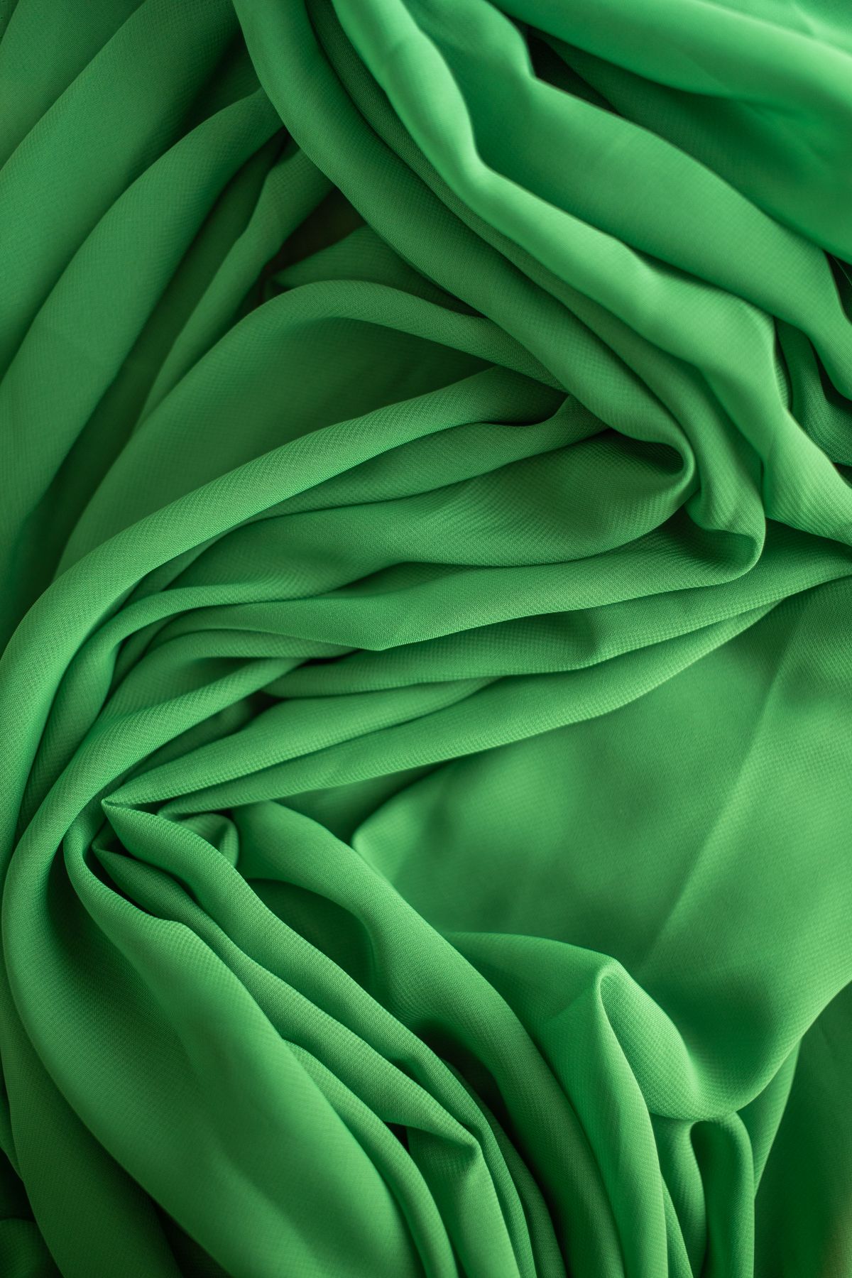 Sage green dress fabric swatches in chiffon and satin
