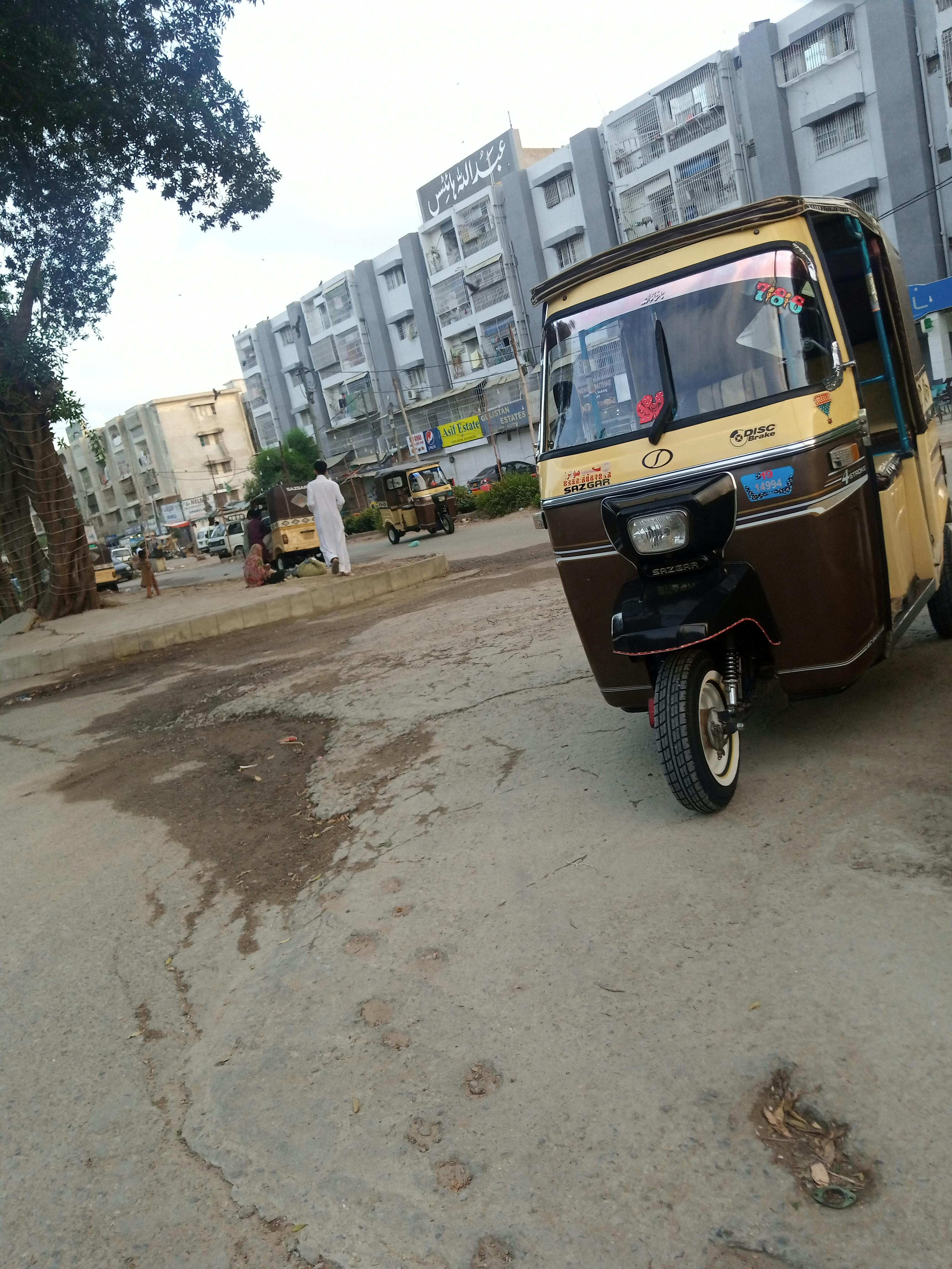 Silhouette of a person wearing a headset looking at a futuristic digital cityscape