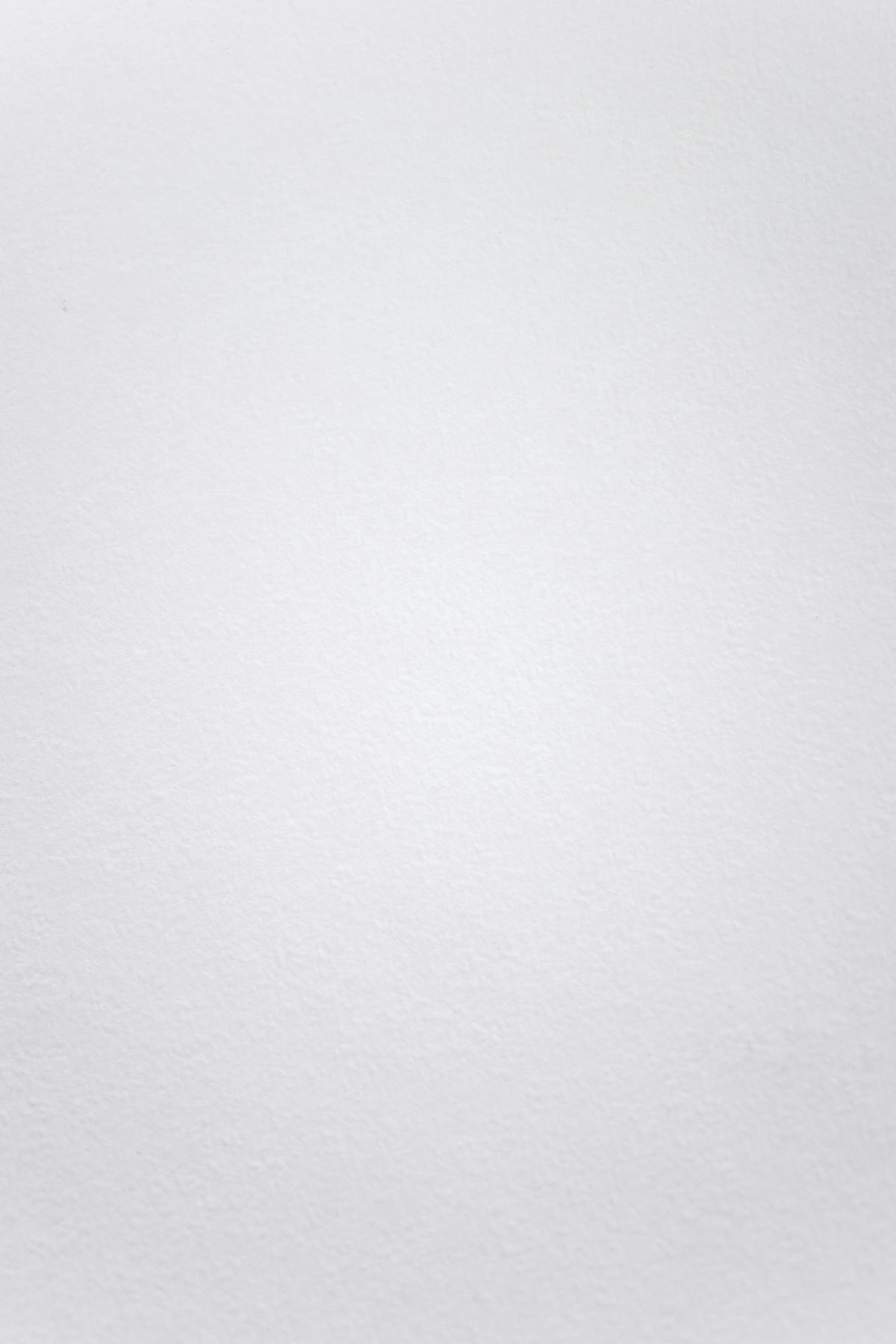 Close-up of a person holding a medical injection pen at a table