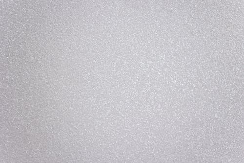 Abstract textured background representing light gray surface with many tiny drops of water