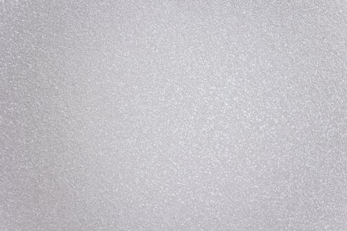 Abstract textured background representing light gray surface with many tiny drops of water