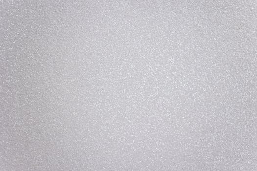 Abstract textured background representing light gray surface with many tiny drops of water