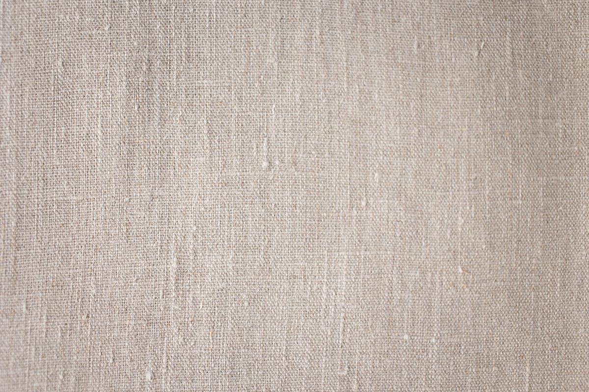 Close-up of linen textile — tactile, craft-forward detail