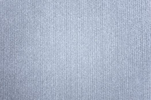Seamless gray textile background with a linear pattern providing ample copy space.