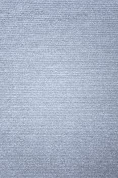 Gray textured fabric background featuring subtle linear patterns, perfect for minimalist design use.