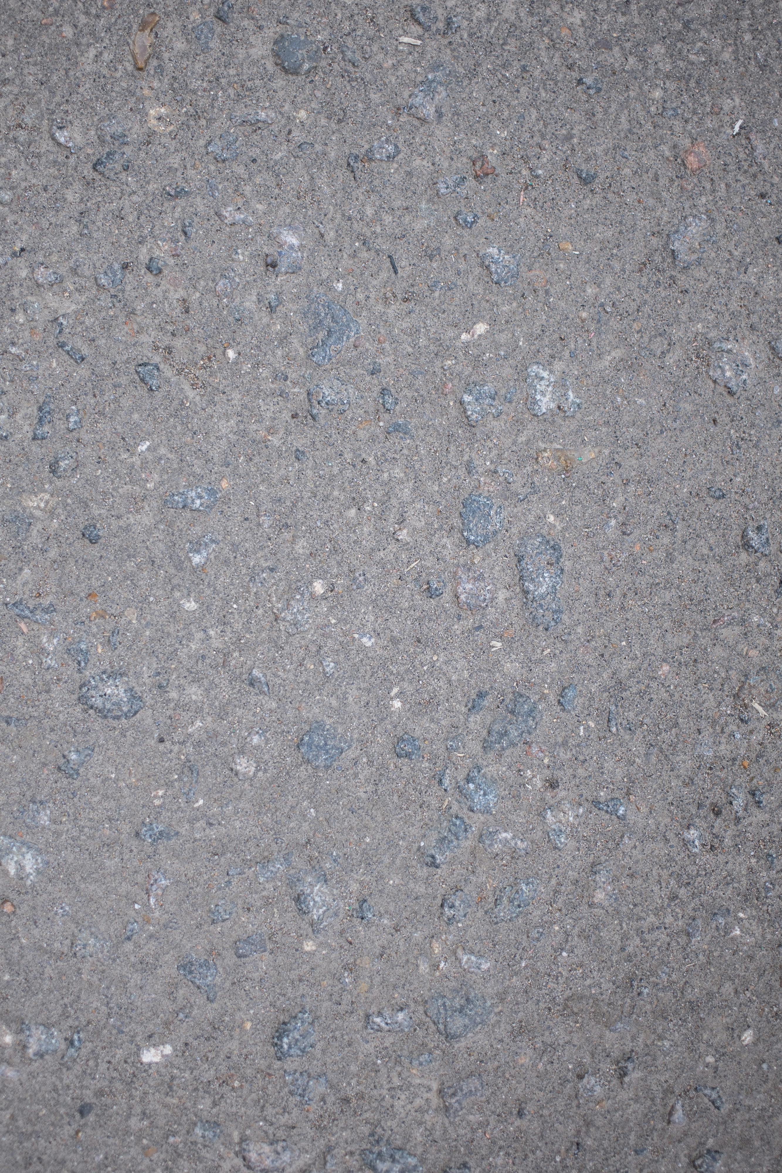 rough gray surface with stones