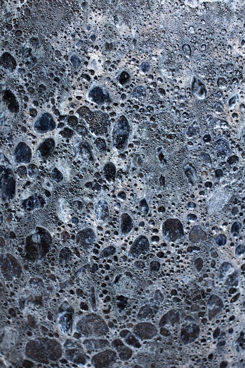 Cellular background of uneven black and white surface representing stones of various size