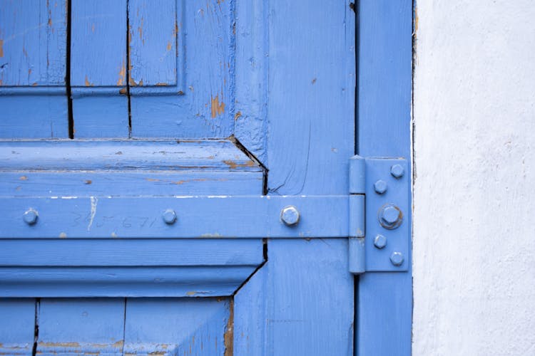 Shabby Blue Wooden Door With Metal Hinge