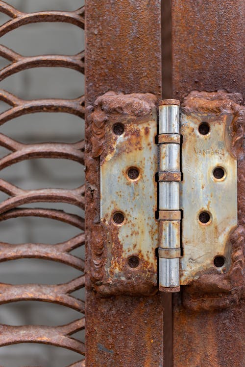 Weathered hinge with rusty metal