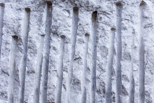 Old stone wall with hollowed lines