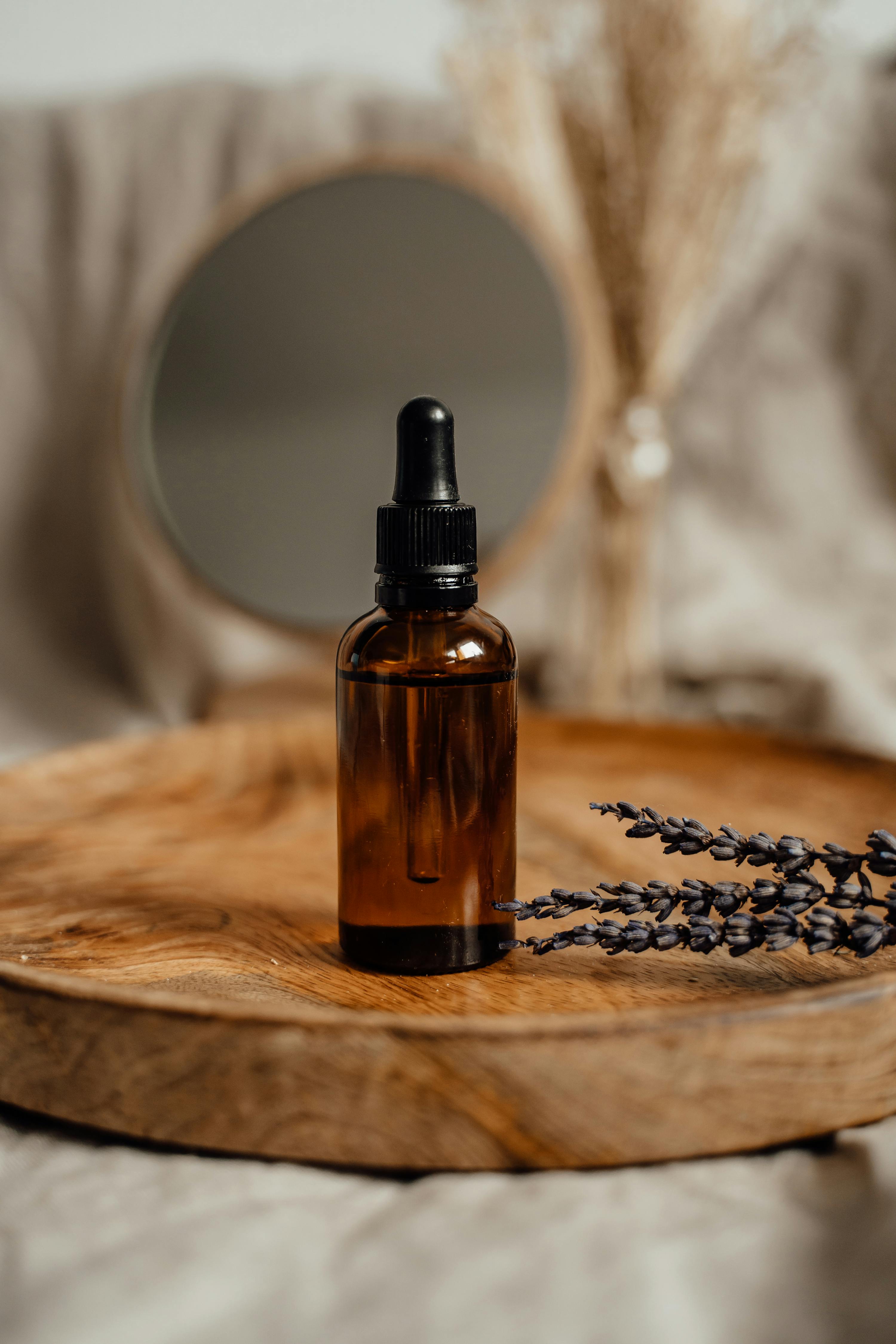 Black glass bottle on brown wooden table photo – Free Shaker Image on  Unsplash