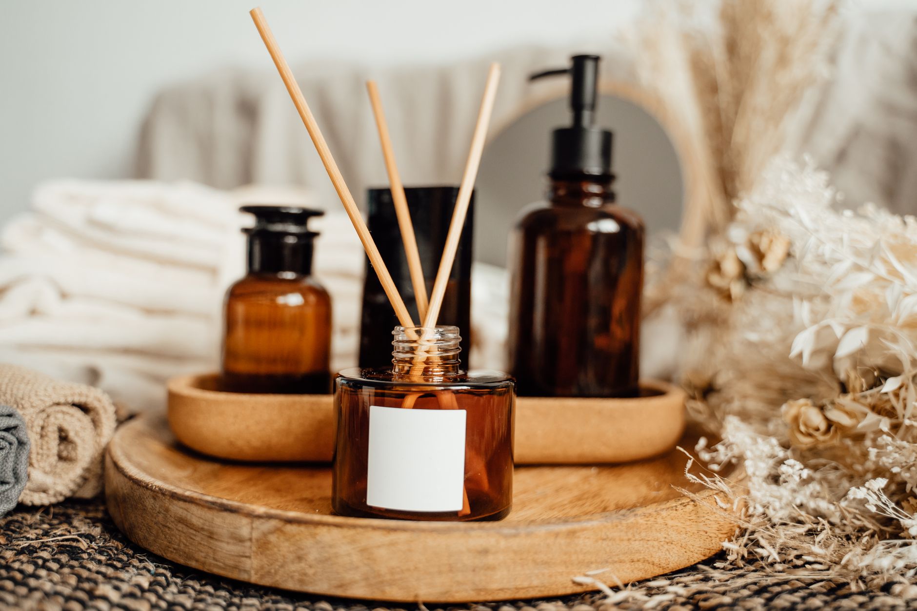 A soothing aromatherapy arrangement with amber bottles and dried flowers for a better bedtime ritual