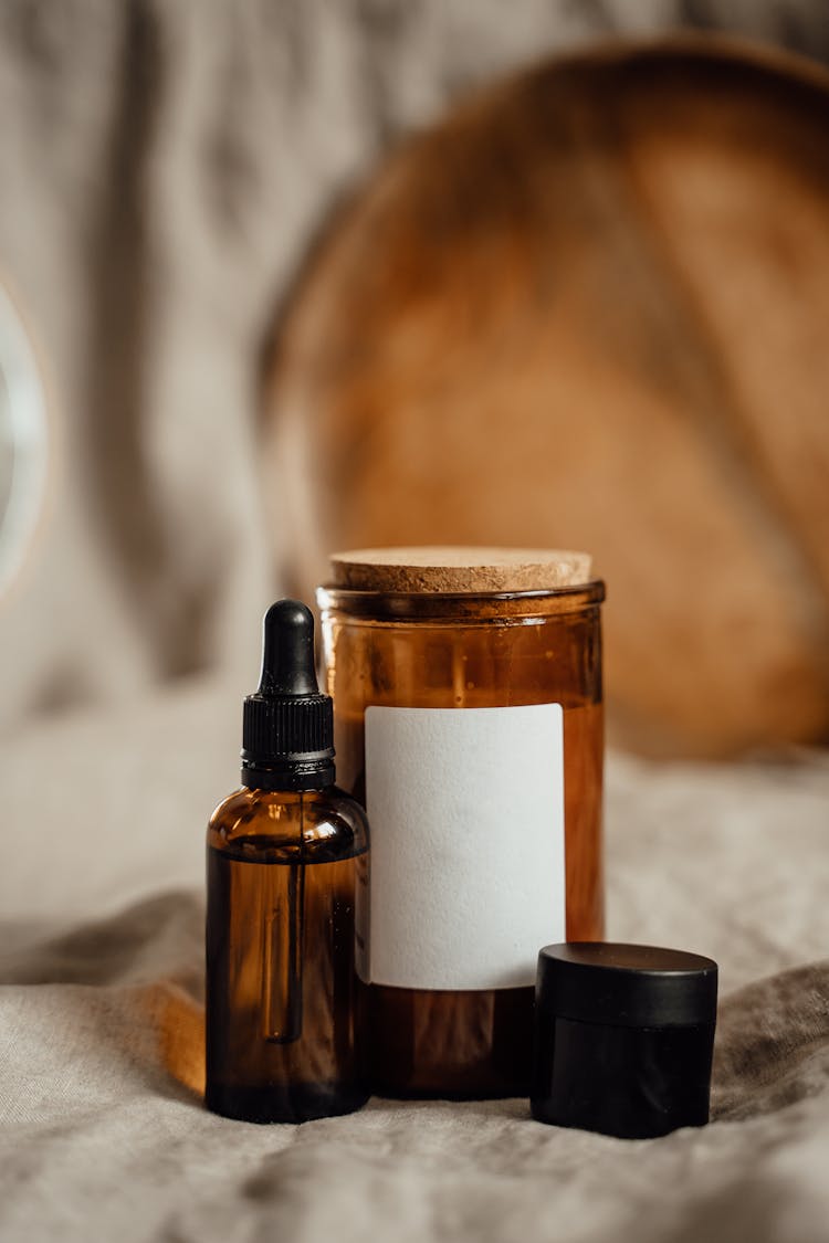 Candle In Glass Jar And Bottle With Dropper