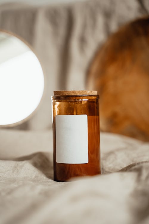 Free Brown Glass Jar With a Blank Label Stock Photo