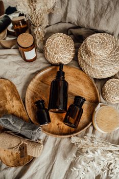 Eco-friendly skincare display with brown bottles on a rustic setup.