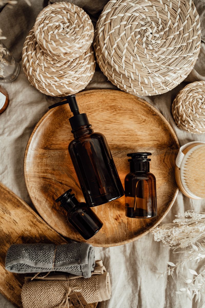 Skincare bottles and serums arranged in a flat lay composition