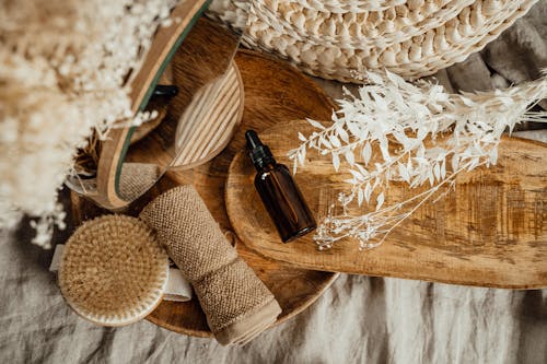 Cosmetic Brown Glass Bottle on Wooden Tray