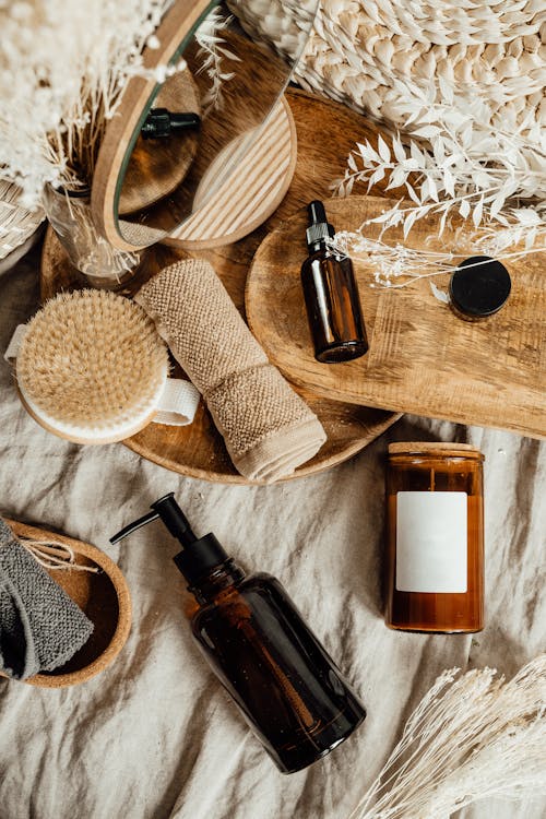 Cosmetic Brown Glass Bottles on Wooden Tray