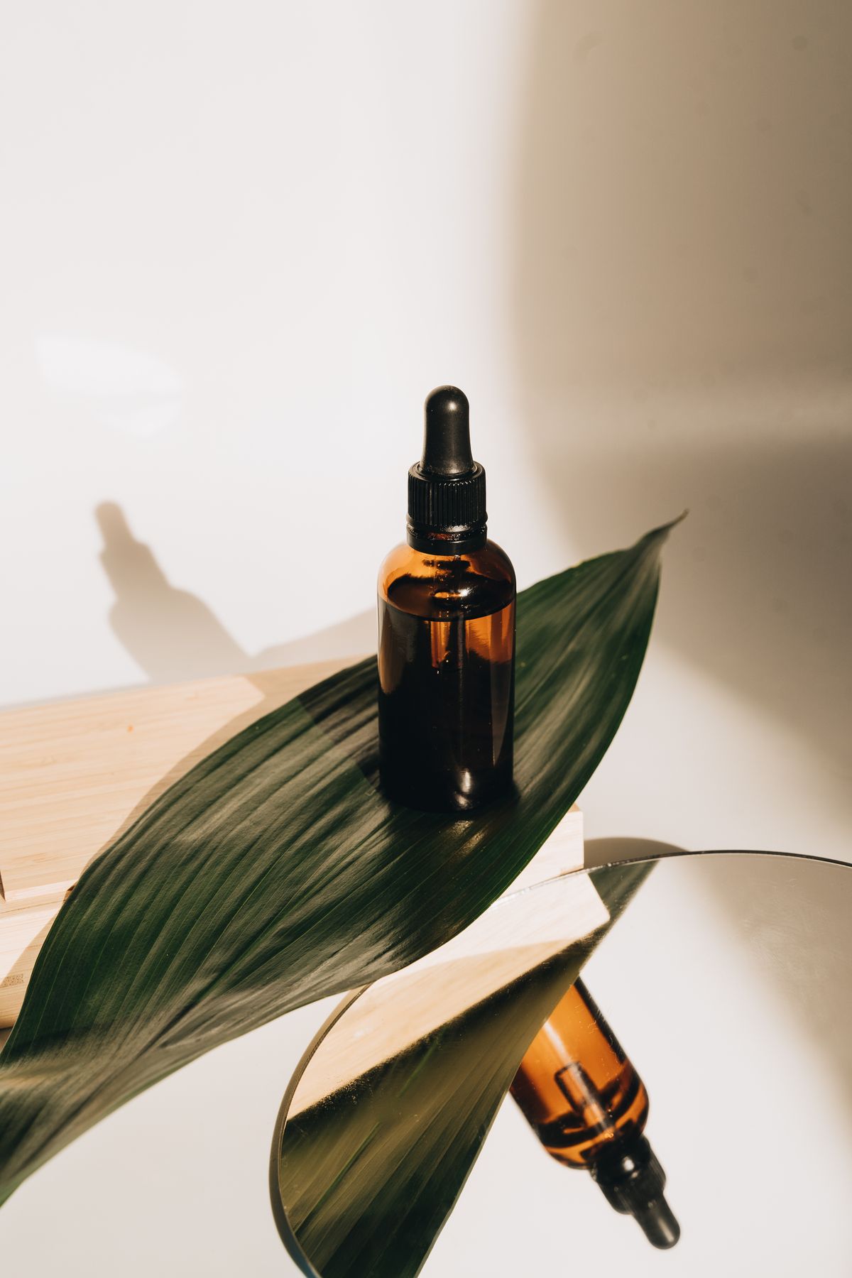 Botanical skincare bottle with a green leaf
