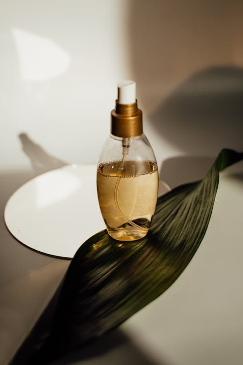 Free Spray Bottle on Top of a Leaf Stock Photo