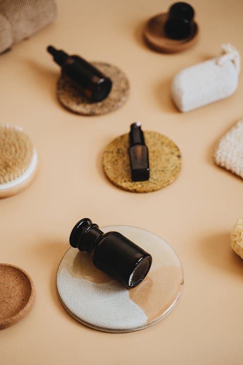 Bottles on Cork Coasters on a Flat Surface