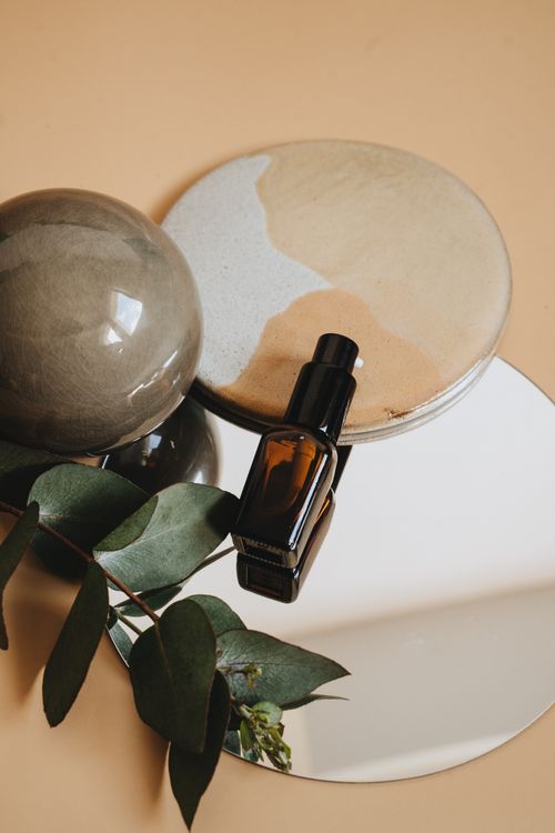 Free A stylish arrangement featuring a perfume bottle with natural elements, ideal for product photography. Stock Photo