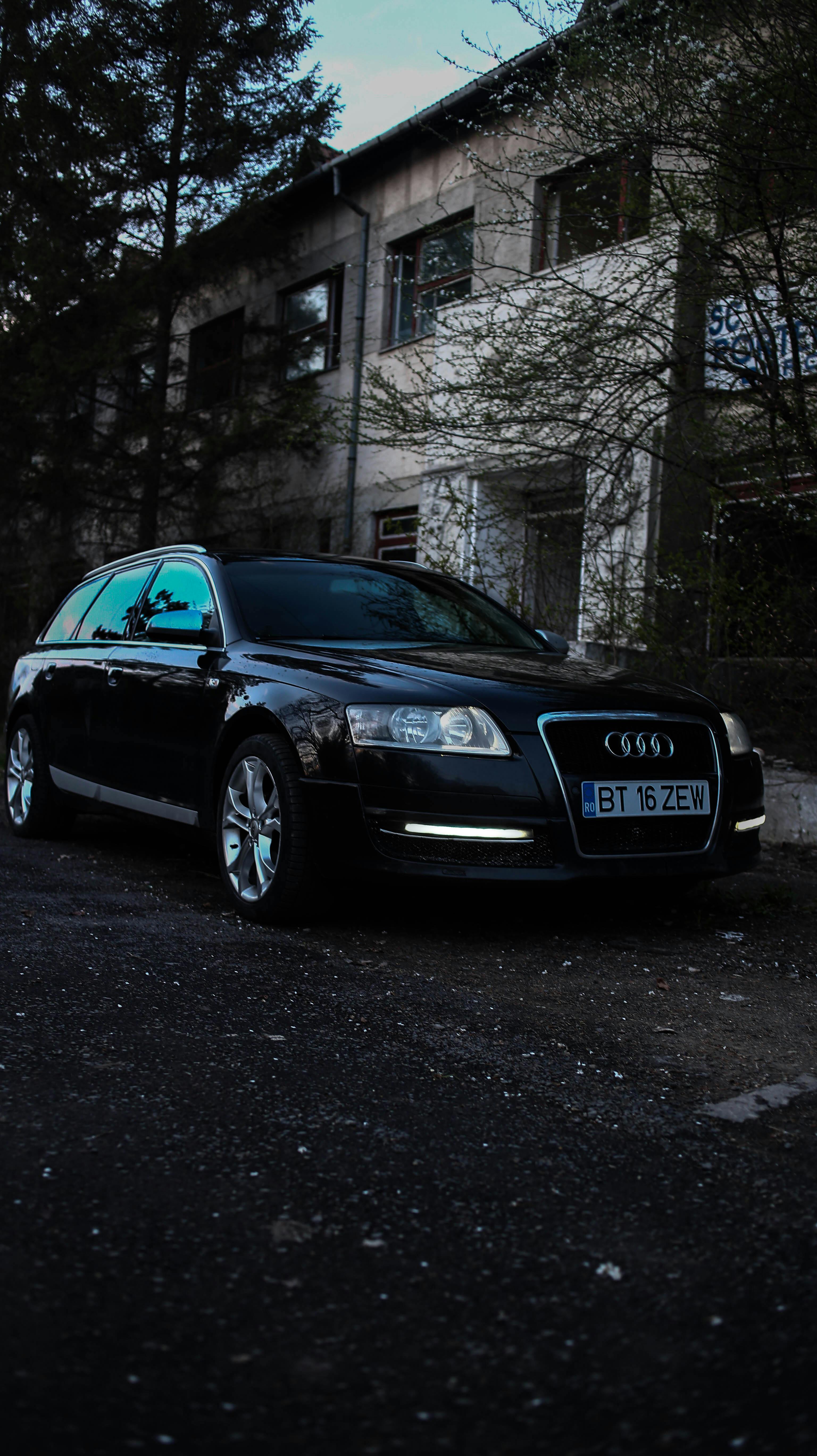 black audi coupe parked on the street