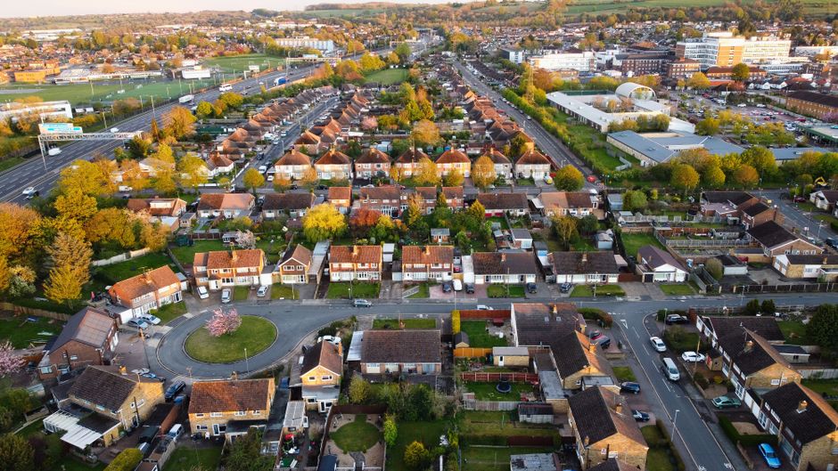Aerial shot of a residential neighborhood in Luton, England captured during sunset.