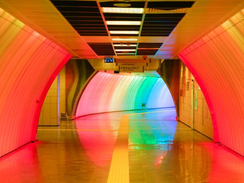 Free Vibrant rainbow-lit corridor in Istanbul's metro station, showcasing modern architecture. Stock Photo