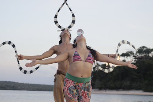 Free Man and Woman Dancing and Balancing Objects on Their Heads  Stock Photo