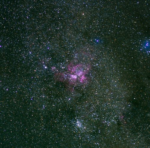 Free A captivating view of a star-studded night sky featuring a vibrant nebula. Stock Photo