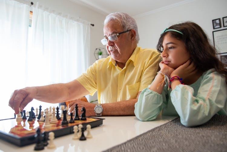 An Elderly Man Playing Chess