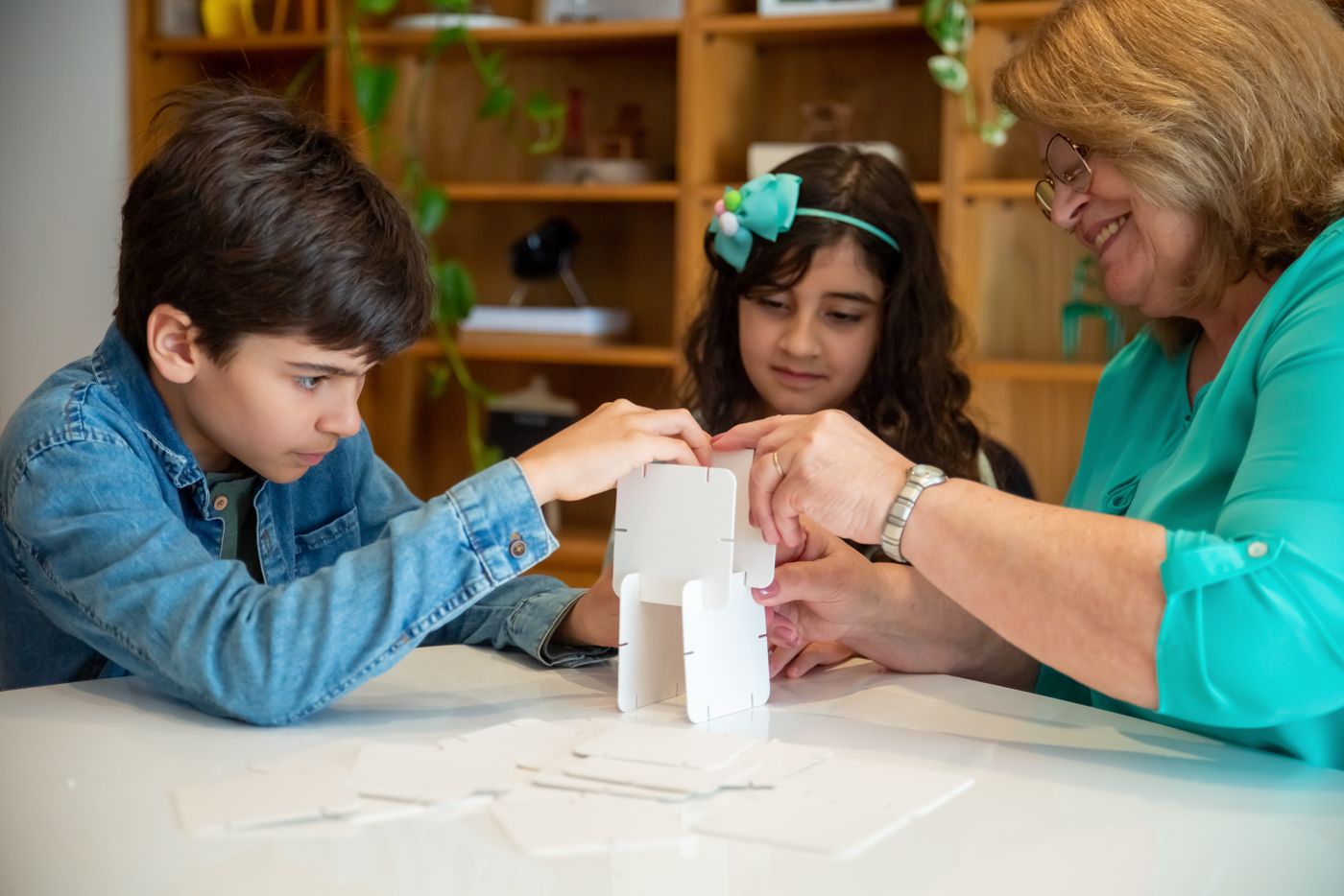 Grandmother doing an activity with grandchildren