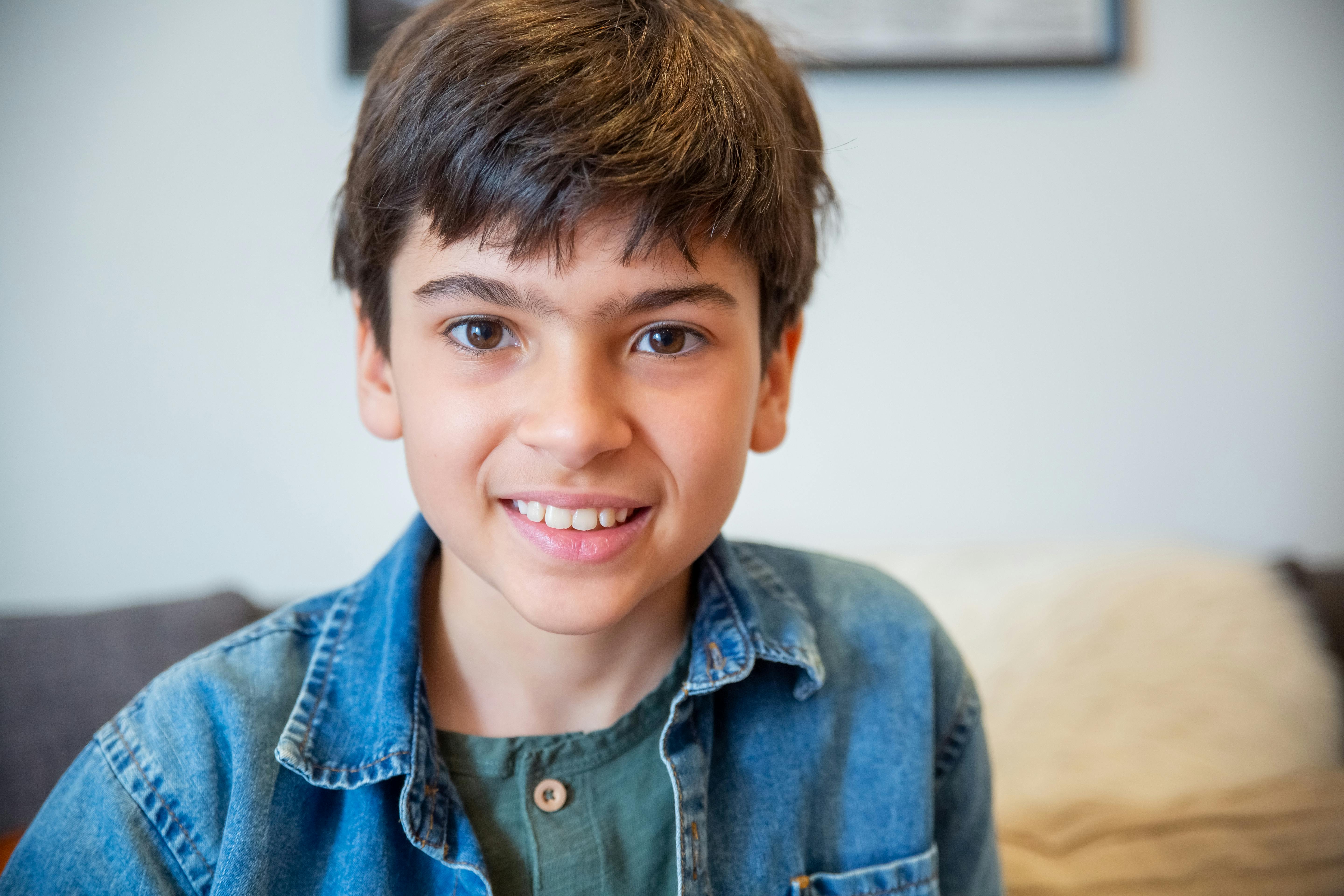 Boy in Blue Denim Jacket Smiling · Free Stock Photo