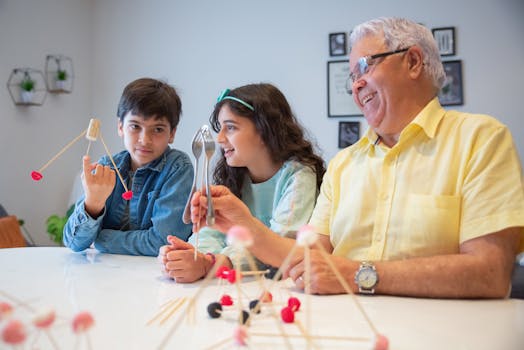 Grandfather enjoying creative time with grandchildren using building sticks