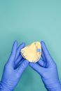 Person Holding Yellow and White Floral Heart Shaped Ornament