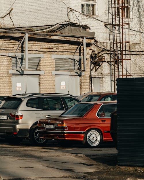 Vehicles Parked Beside a Building