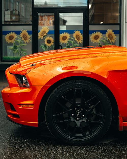 Close Up Photo of an Orange Car 