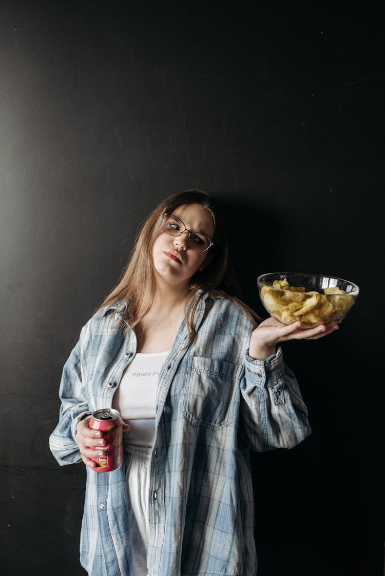 Woman Holding Bowl Of Chips