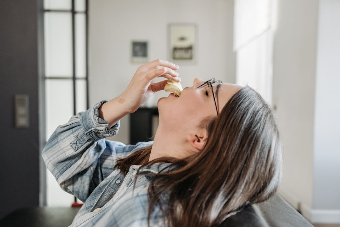 Woman Eating Potato Chips