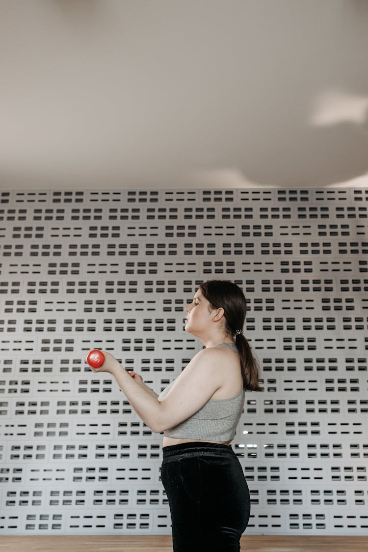 Woman Lifting Dumbbells