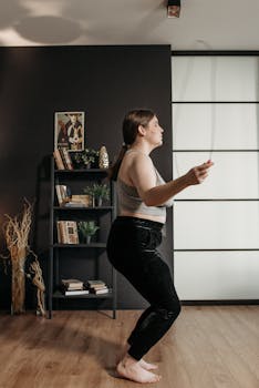 Young woman exercising with a jump rope indoors, promoting a healthy lifestyle.