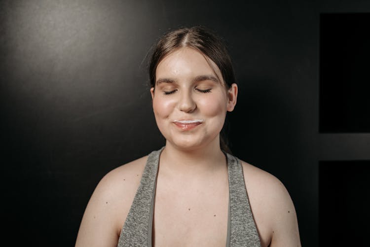 A Happy Woman With A Milk Moustache