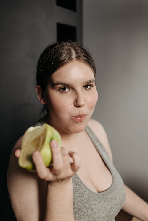Free Woman Eating a Fruit  Stock Photo