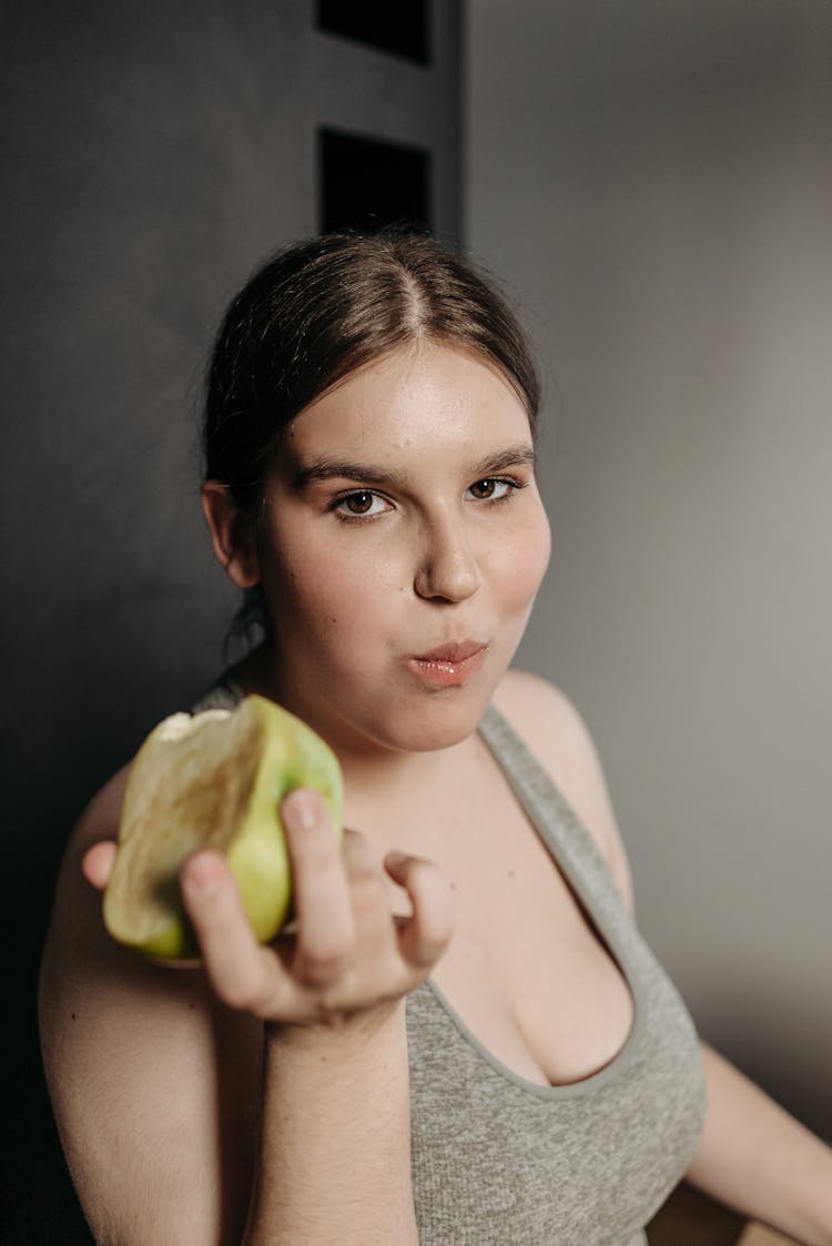 Woman Eating A Fruit 