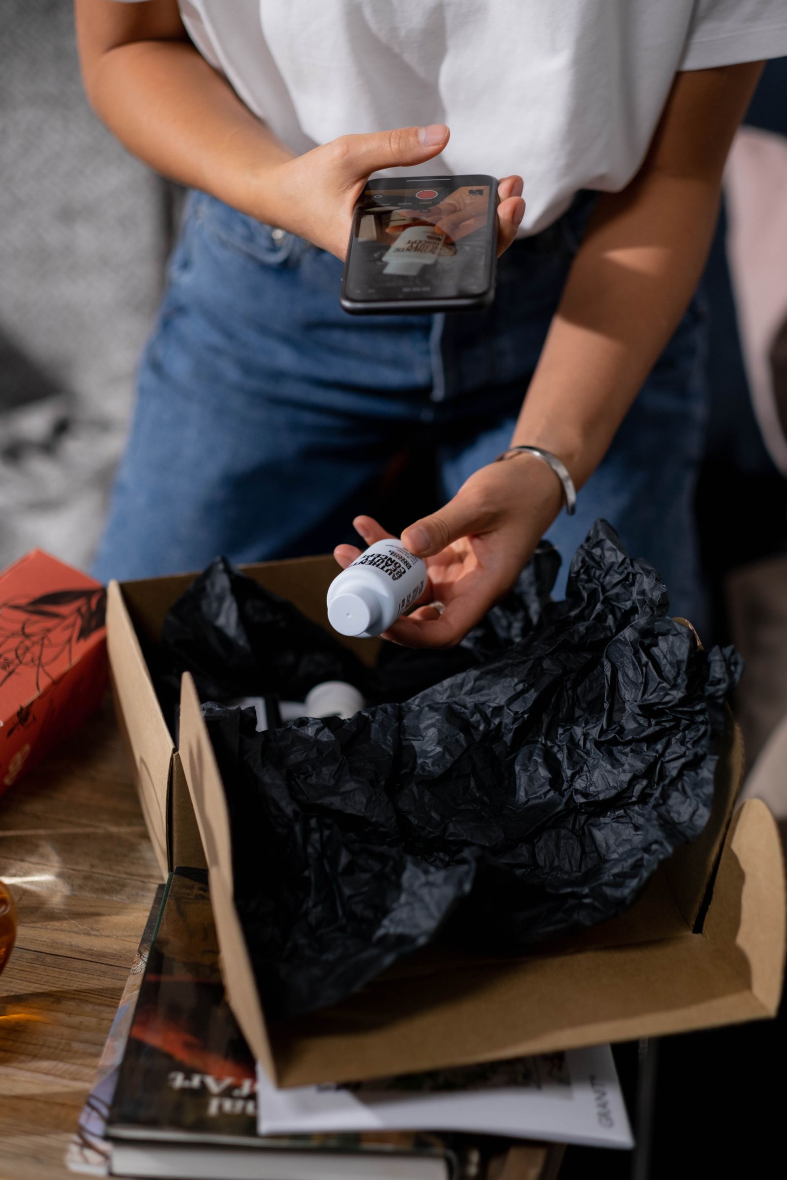 Beauty parcel being opened in a warm home setting