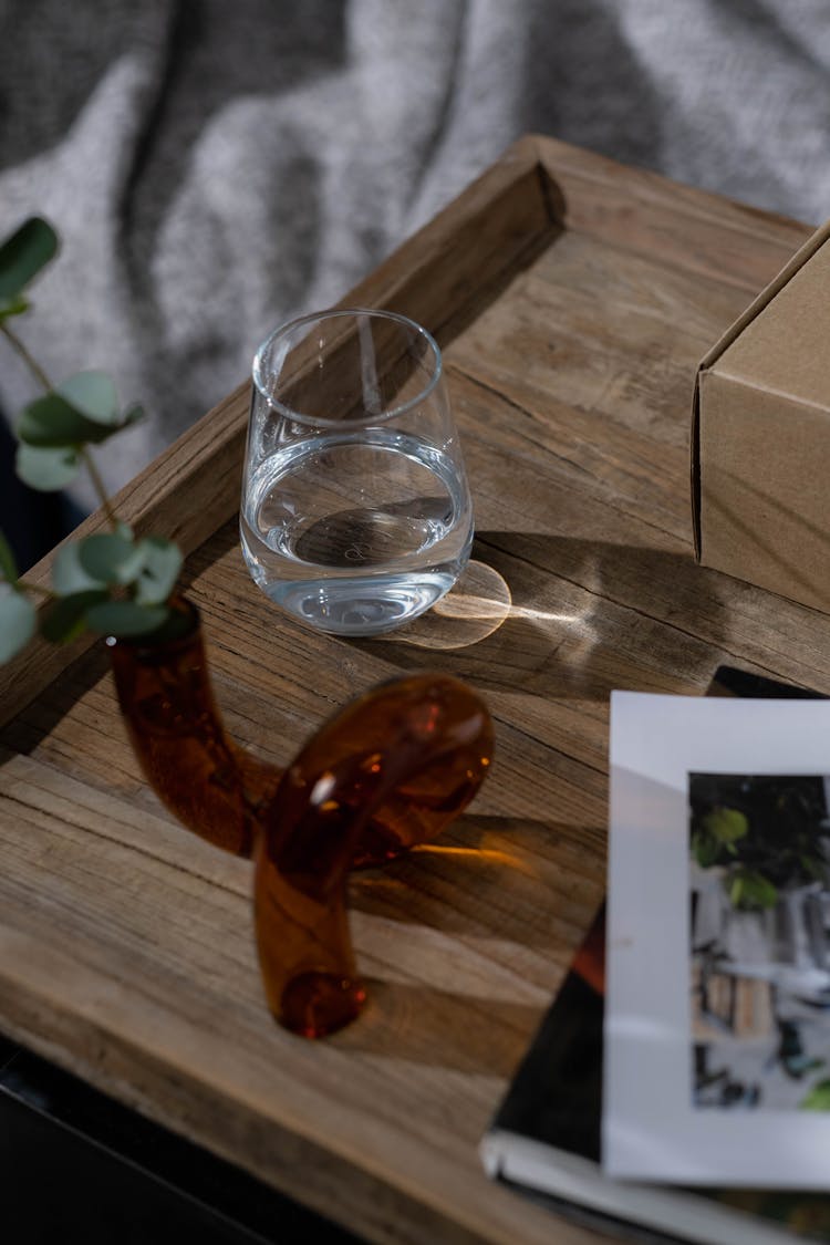 Glass Of Water Standing On A Wooden Tray