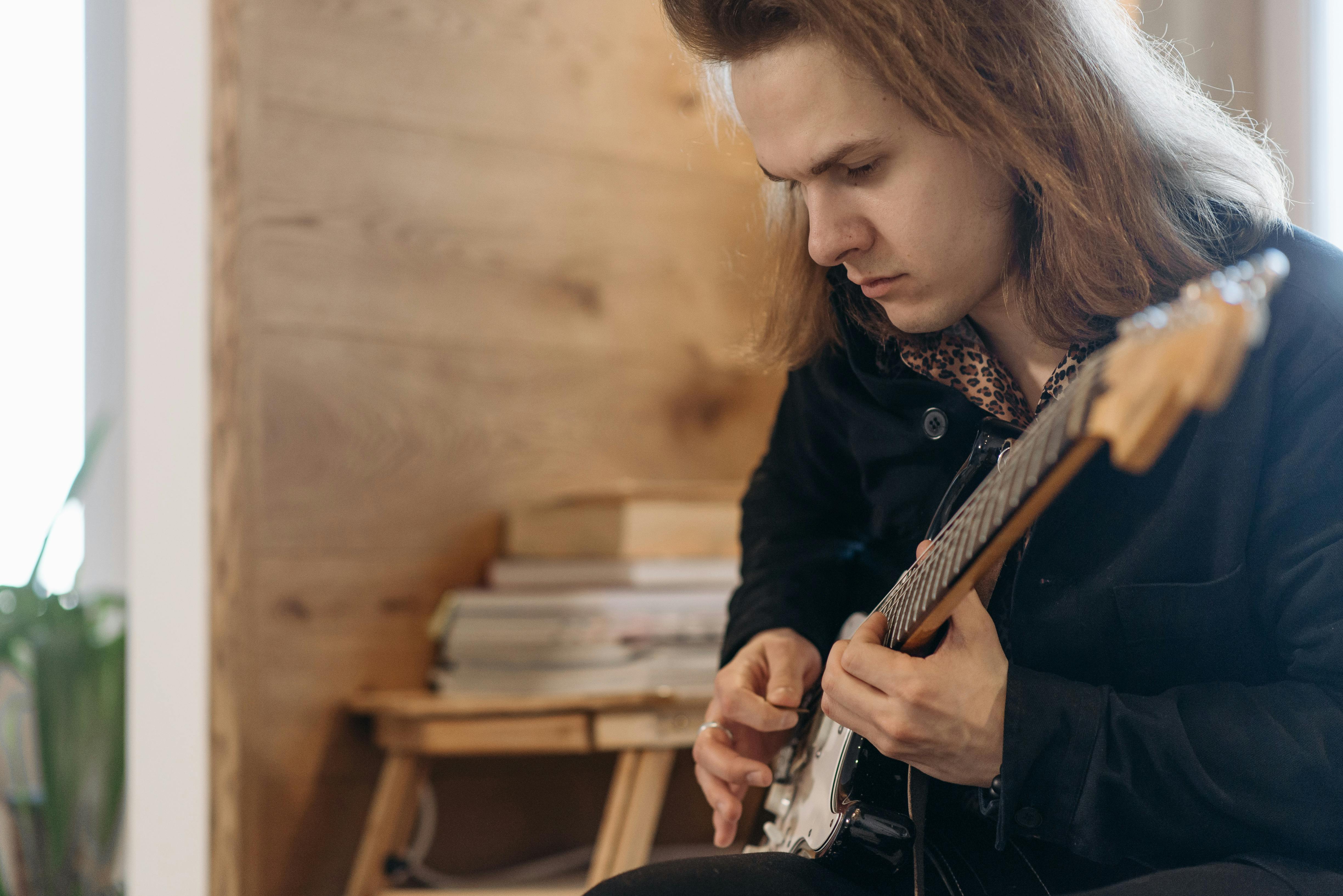 Guitarist practicing on stage lights